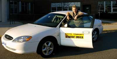 Gary Boyd with Coastal Community student driver car